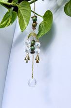 Load image into Gallery viewer, Mini Gold Moon Suncatcher with Turquoise Clay & Tiger’s Eye Beads, Gold Chain, and Bells – Witchy Boho Rainbow Light Decor