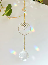 Load image into Gallery viewer, Gold Charm Suncatcher with Moon, Starburst, Round & Diamond Shapes, Green & Blue Glass Beads – Rainbow Prism Window Decor