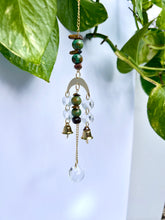 Load image into Gallery viewer, Mini Gold Moon Suncatcher with Turquoise Clay & Tiger’s Eye Beads, Gold Chain, and Bells – Witchy Boho Rainbow Light Decor