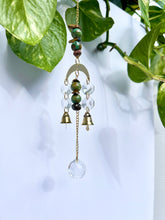 Load image into Gallery viewer, Mini Gold Moon Suncatcher with Turquoise Clay & Tiger’s Eye Beads, Gold Chain, and Bells – Witchy Boho Rainbow Light Decor