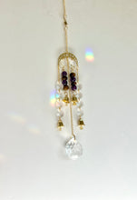 Load image into Gallery viewer, Gold Moon Phase Suncatcher with Amethyst & Tiger’s Eye Beads, Gold Starburst Charm, Bells, and Sun Prism Beads – Witchy Boho Decor