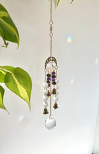 Load image into Gallery viewer, Gold Moon Phase Suncatcher with Amethyst & Tiger’s Eye Beads, Gold Starburst Charm, Bells, and Sun Prism Beads – Witchy Boho Decor