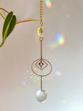 Load image into Gallery viewer, Gold Charm Suncatcher with Moon, Starburst, Round & Diamond Shapes, Green & Blue Glass Beads – Rainbow Prism Window Decor