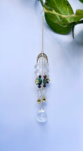 Load image into Gallery viewer, Gold Moon Phases Suncatcher with Turquoise & Tiger’s Eye Beads, Bells, and Crystal Accents – Witchy Boho Decor