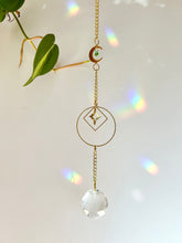 Load image into Gallery viewer, Gold Charm Suncatcher with Moon, Starburst, Round & Diamond Shapes, Green & Blue Glass Beads – Rainbow Prism Window Decor