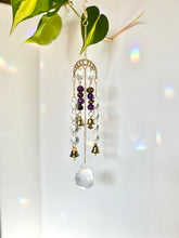 Load image into Gallery viewer, Gold Moon Phase Suncatcher with Amethyst & Tiger’s Eye Beads, Gold Starburst Charm, Bells, and Sun Prism Beads – Witchy Boho Decor