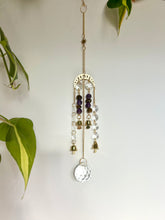 Load image into Gallery viewer, Gold Moon Phase Suncatcher with Amethyst & Tiger’s Eye Beads, Gold Starburst Charm, Bells, and Sun Prism Beads – Witchy Boho Decor
