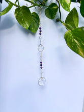 Load image into Gallery viewer, Elegant gold circle suncatcher with Amethyst and Citrine beads and two sparkling prisms