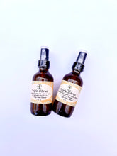 Load image into Gallery viewer, Citrus body and yoga mat spray on a wooden surface with herbs