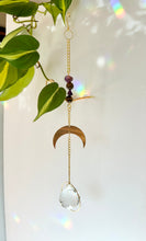 Load image into Gallery viewer, Crystal window decor suncatcher featuring gold half moon charm, Amethyst and Tiger’s Eye beads, and rainbow prism