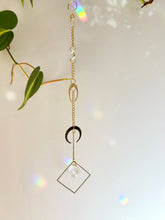 Load image into Gallery viewer, Back view of double gold moon suncatcher showing gold chain and hanging setup