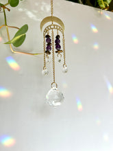 Load image into Gallery viewer, Double gold moon suncatcher with Amethyst and Tiger’s Eye beads, prism accents, and gold chain for rainbow light