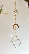Load image into Gallery viewer, Close-up of gold moon charms and prism detail on hanging suncatcher