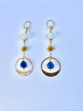 Load image into Gallery viewer, Handmade moonstone and denim opal celestial earrings with gold brass findings on a white background.