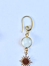 Load image into Gallery viewer, Close-up of faceted moonstone and denim opal gemstones in handcrafted brass earrings.