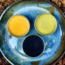 Load image into Gallery viewer, Herbal salve set in 2 oz. screw-top tins, offering easy portability and convenient application for everyday use.