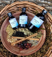 Load image into Gallery viewer, Elderberry Elixir Syrup with Echinacea + Raw Honey for Winter Wellness in 1 oz. Glass Bottle