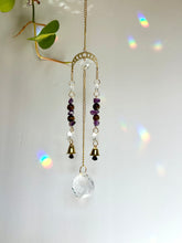 Load image into Gallery viewer, Gold Moon Phases Suncatcher with Amethyst &amp; Tiger’s Eye Beads and Gold Bells – Celestial Window Decor

