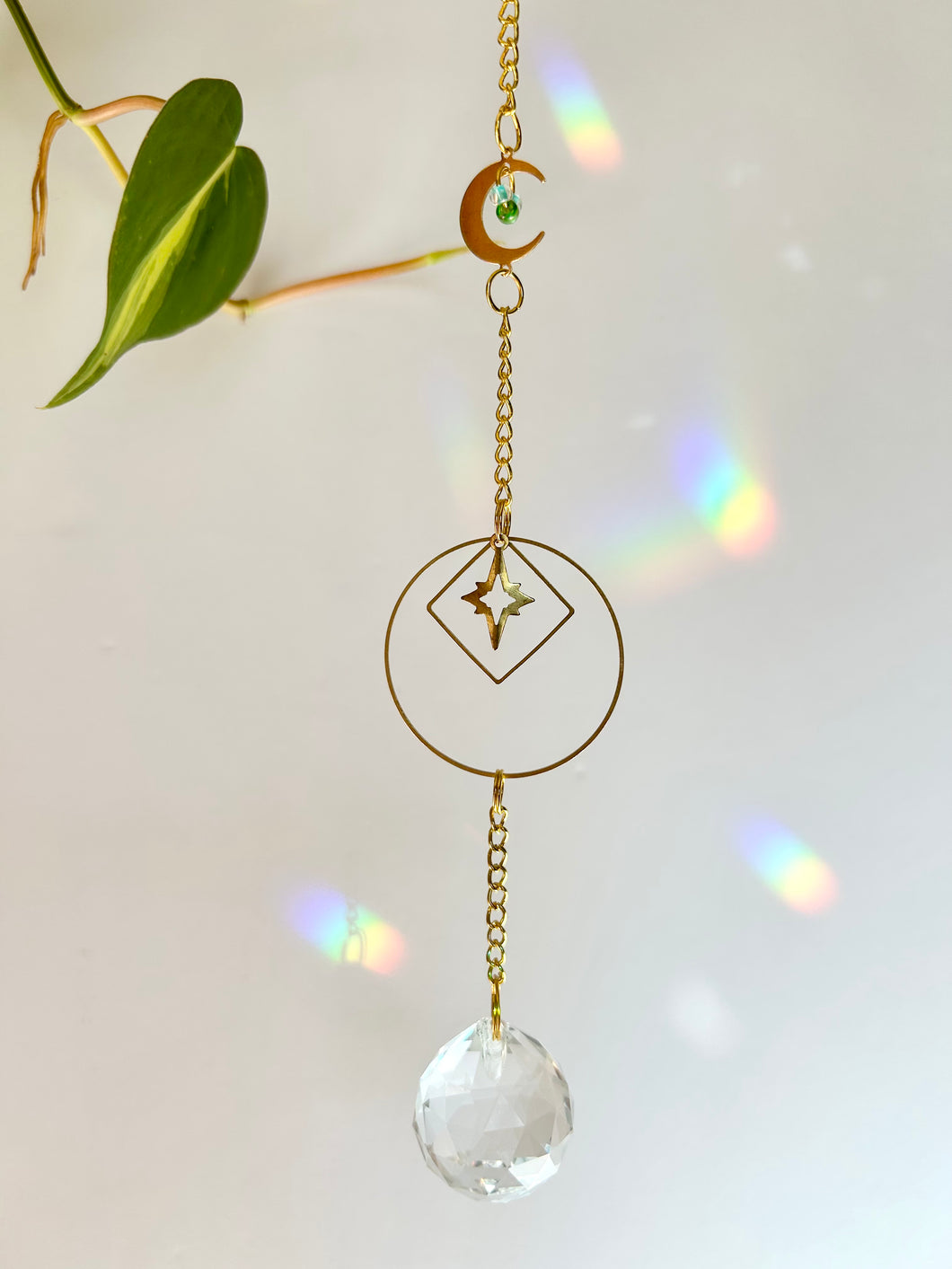 Gold Charm Suncatcher with Moon, Starburst, Round & Diamond Shapes, Green & Blue Glass Beads – Rainbow Prism Window Decor