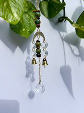 Load image into Gallery viewer, Mini Gold Moon Suncatcher with Turquoise Clay &amp; Tiger’s Eye Beads, Gold Chain, and Bells – Witchy Boho Rainbow Light Decor
