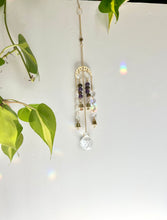 Load image into Gallery viewer, Gold Moon Phase Suncatcher with Amethyst &amp; Tiger’s Eye Beads, Gold Starburst Charm, Bells, and Sun Prism Beads – Witchy Boho Decor
