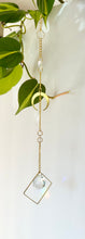 Load image into Gallery viewer, Double Gold Half Moon Suncatcher with Prism in Diamond Frame – Mystical Rainbow Window Decor
