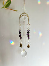 Load image into Gallery viewer, Gold Moon Phases Suncatcher with Amethyst &amp; Tiger’s Eye Beads and Gold Bells – Celestial Window Decor
