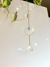Load image into Gallery viewer, Gold Charm Suncatcher with Moon, Starburst, Round &amp; Diamond Shapes, Green &amp; Blue Glass Beads – Rainbow Prism Window Decor

