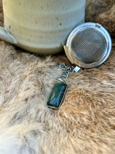Labradorite gemstone tea infuser for brewing loose leaf tea with spiritual energy, ideal for meditation and tea rituals.