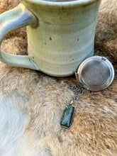 Load image into Gallery viewer, Unique Labradorite tea ball for loose leaf tea, offering intuitive energy and protection during your tea rituals and spiritual practices.
