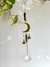 Load image into Gallery viewer, Celestial gold half moon suncatcher with Agate and Tiger’s Eye beads and rainbow prism light

